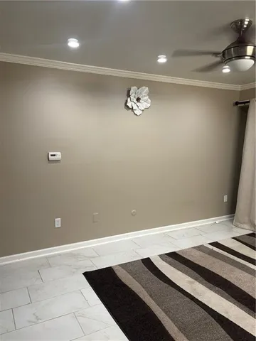 a view of a room with wooden floor