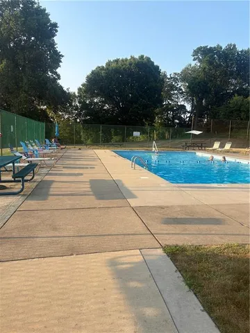 a view of backyard and swimming pool