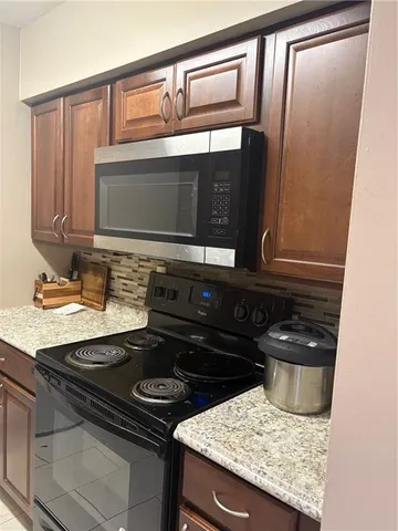 a kitchen with a stove and a microwave