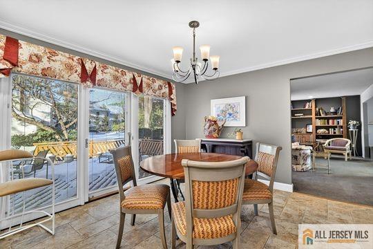 29 Darby Road East Brunswick, NJ 08816 - Photo 12 of 34 a dining room with furniture a rug and a large window