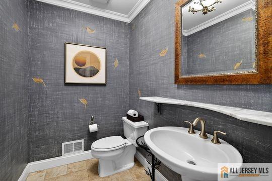 29 Darby Road East Brunswick, NJ 08816 - Photo 22 of 34 a bathroom with a toilet a sink and mirror