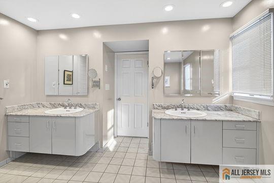 29 Darby Road East Brunswick, NJ 08816 - Photo 28 of 34 a bathroom with a sink and a mirror