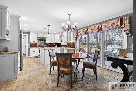 29 Darby Road East Brunswick, NJ 08816 - Photo 6 of 34 a view of a dining room with furniture window and outside view