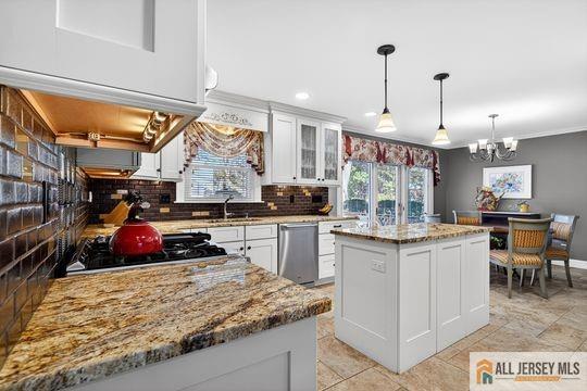 29 Darby Road East Brunswick, NJ 08816 - Photo 8 of 34 a kitchen with kitchen island granite countertop a stove and a sink