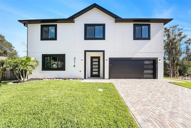 a front view of a house with yard