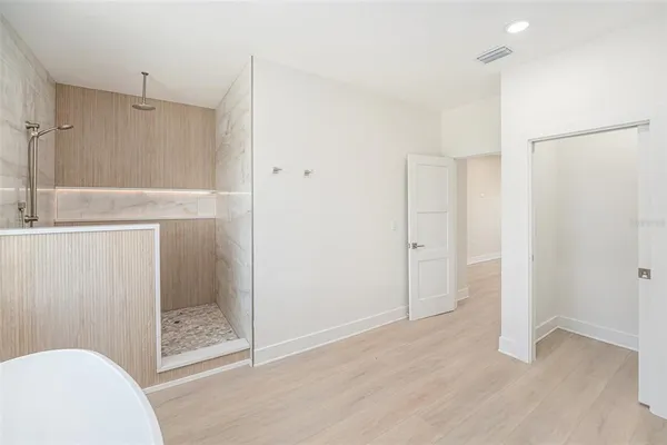 a bathroom with a shower and a toilet