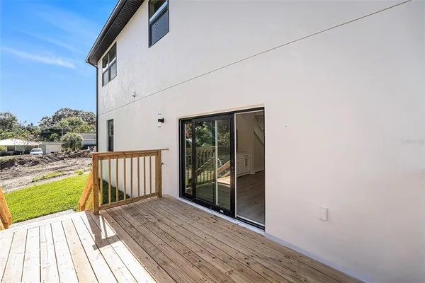 a view of a balcony with wooden floor