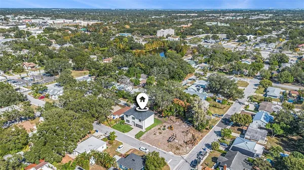an aerial view of residential houses with outdoor space