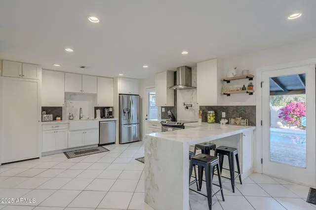 a view of a dining room with furniture and window
