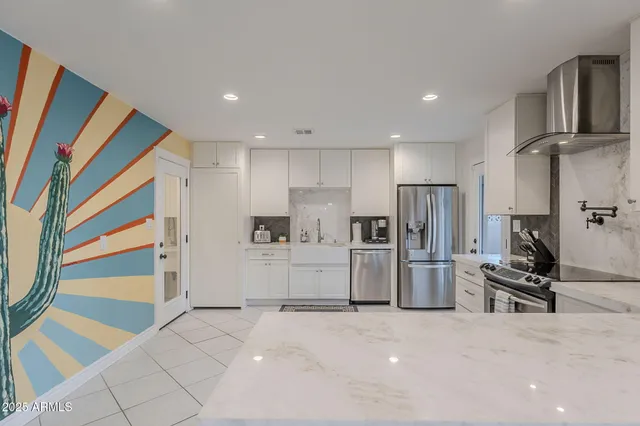 a view of a dining room with furniture wooden floor and chandelier