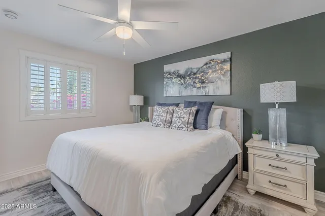 a bathroom with a sink toilet vanity and shower