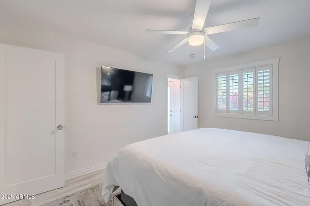 a view of a dining room with furniture and a potted plant