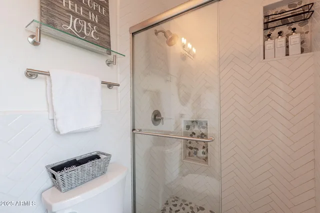 a view of a backyard with table and chairs and potted plants