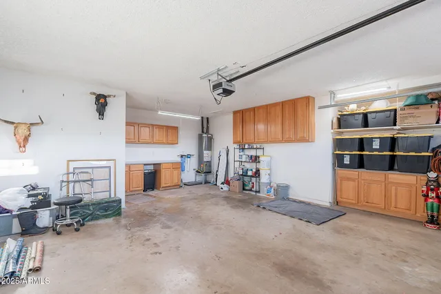 a view of a house with a yard and a tree
