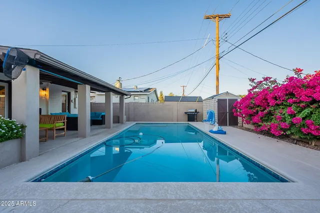a swimming pool with some trees in the background