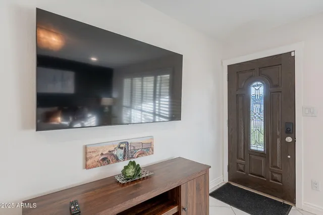 a kitchen with appliances a counter space and a window
