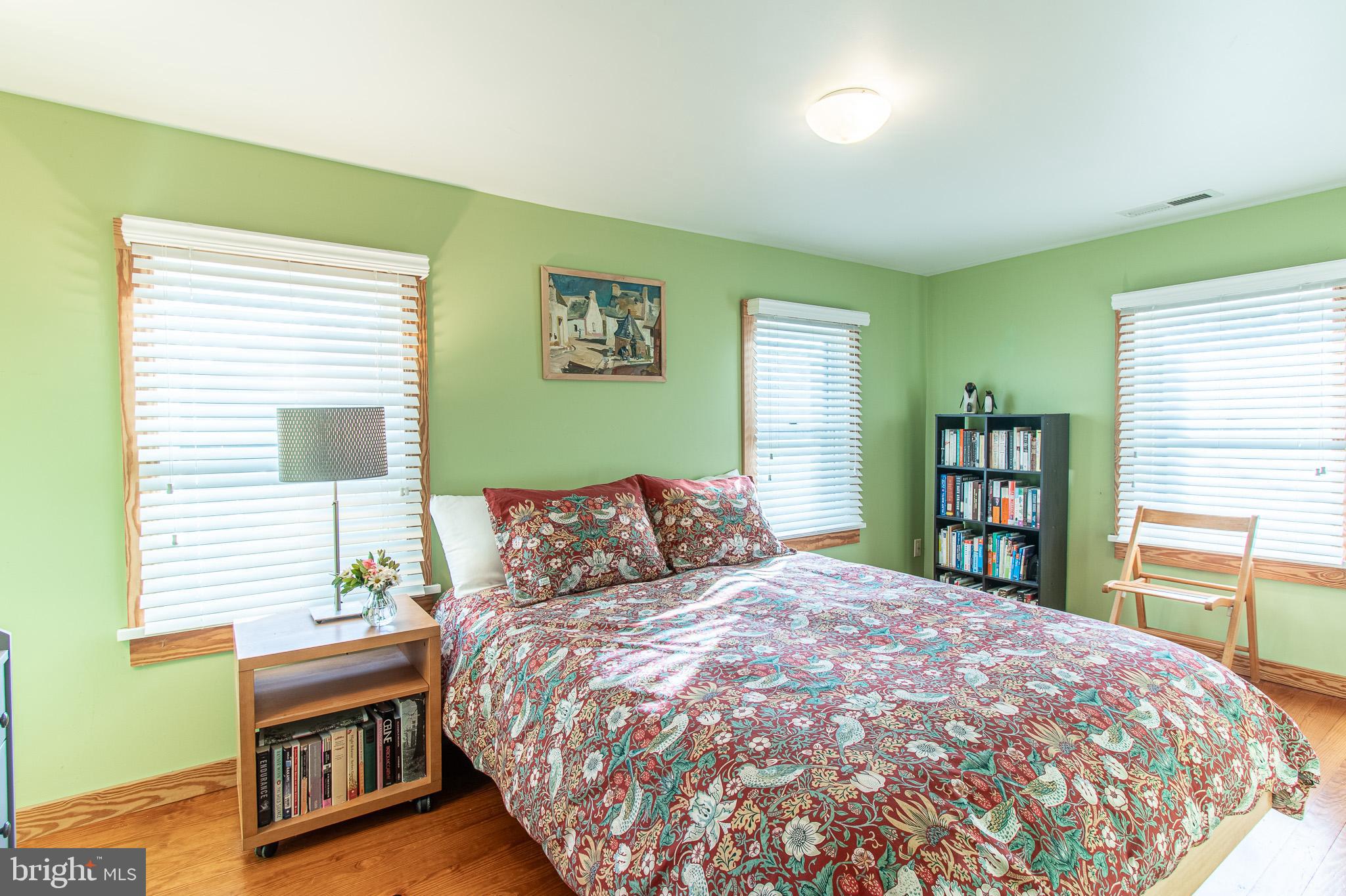 8805 Cummings Road Wittman, MD 21676 - Photo 15 of 39 a bedroom with a large bed and a window