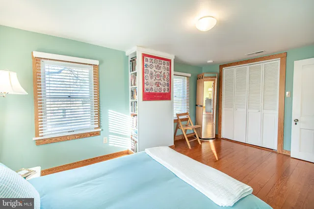 a room with a bed and a window