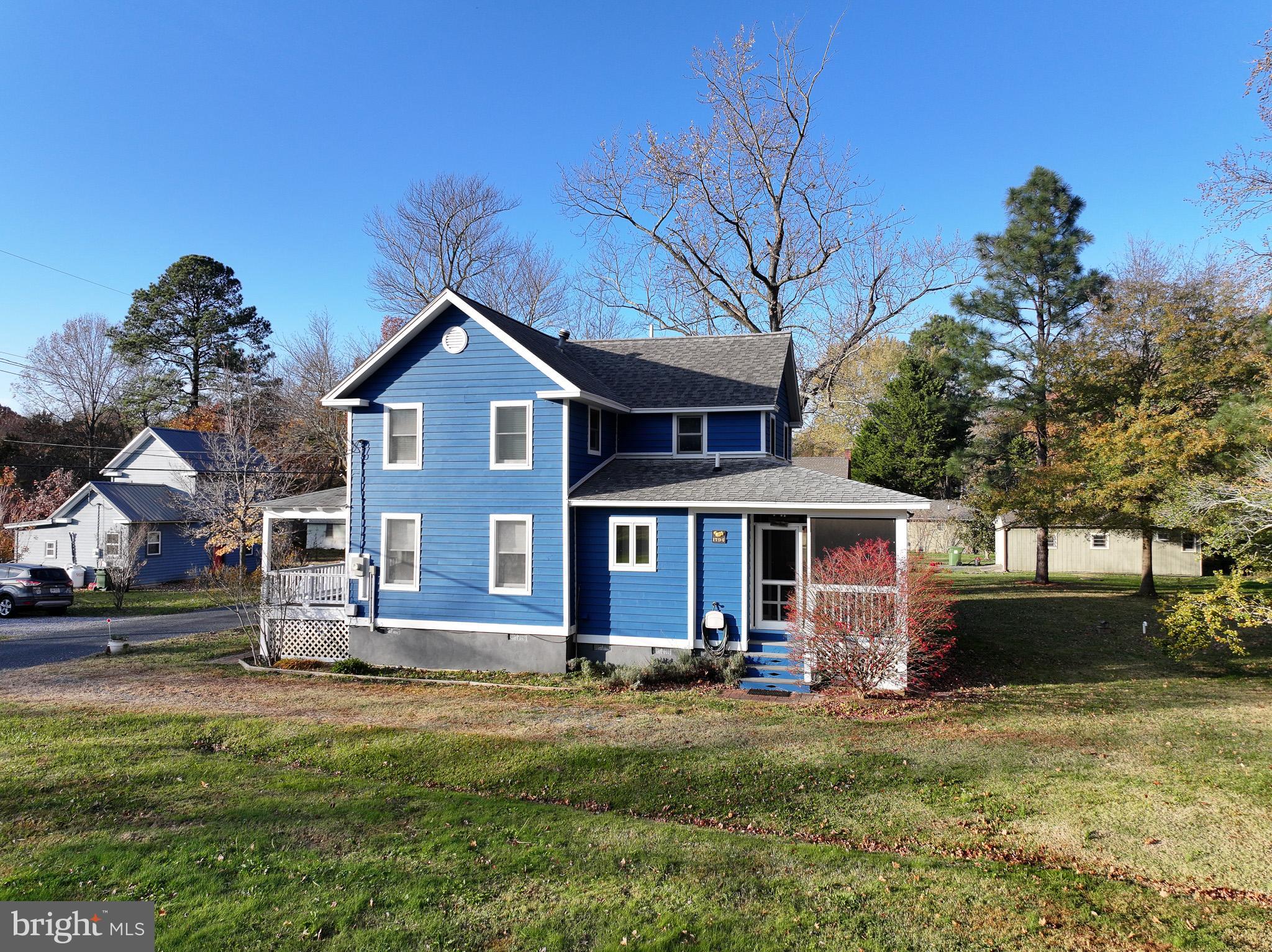 8805 Cummings Road Wittman, MD 21676 - Photo 2 of 39 a front view of a house with a garden
