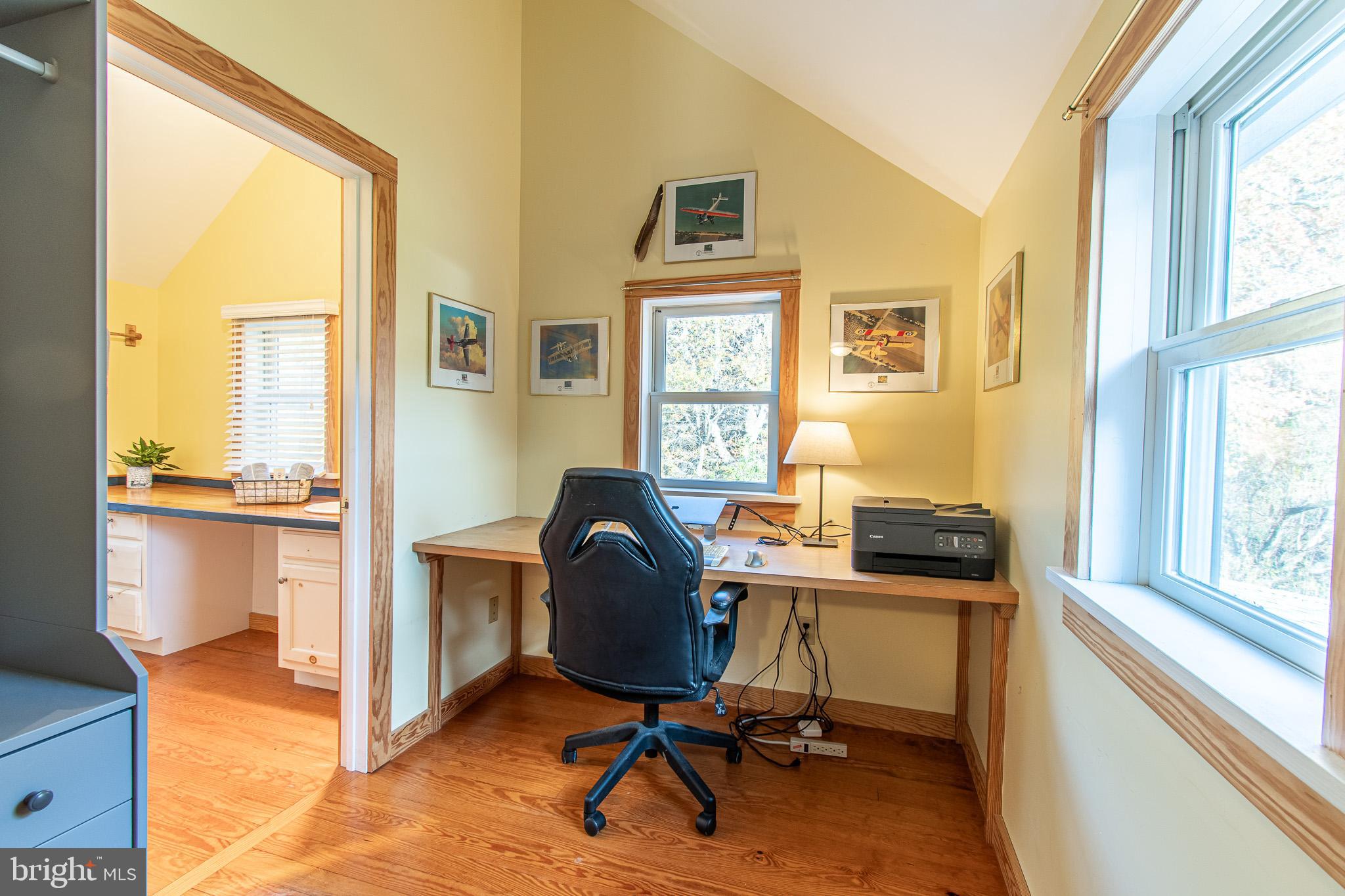 8805 Cummings Road Wittman, MD 21676 - Photo 22 of 39 a view of a workspace with furniture and a window
