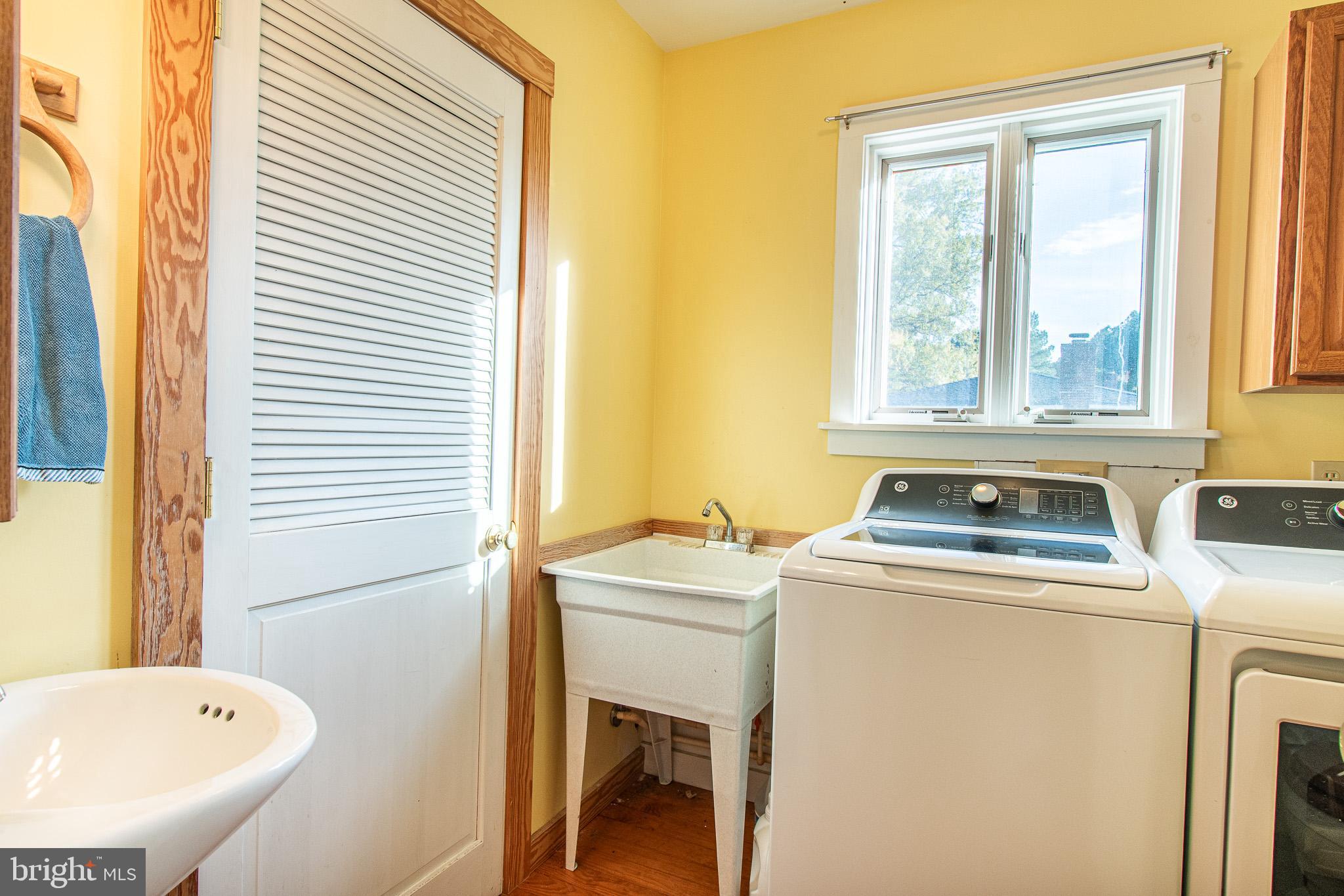 8805 Cummings Road Wittman, MD 21676 - Photo 26 of 39 a bathroom with a sink and a washer dryer