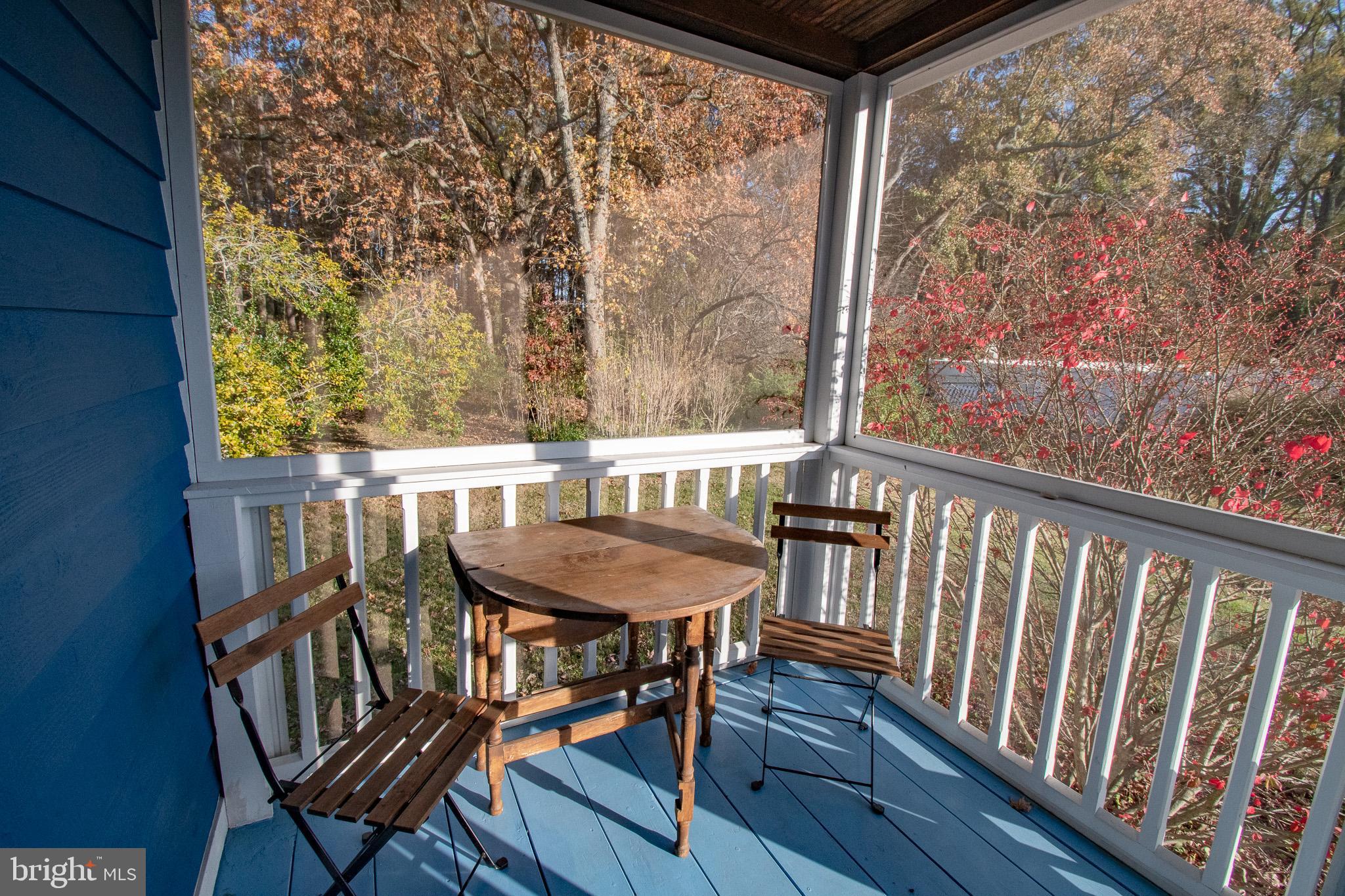 8805 Cummings Road Wittman, MD 21676 - Photo 30 of 39 a view of a balcony with furniture and wooden deck