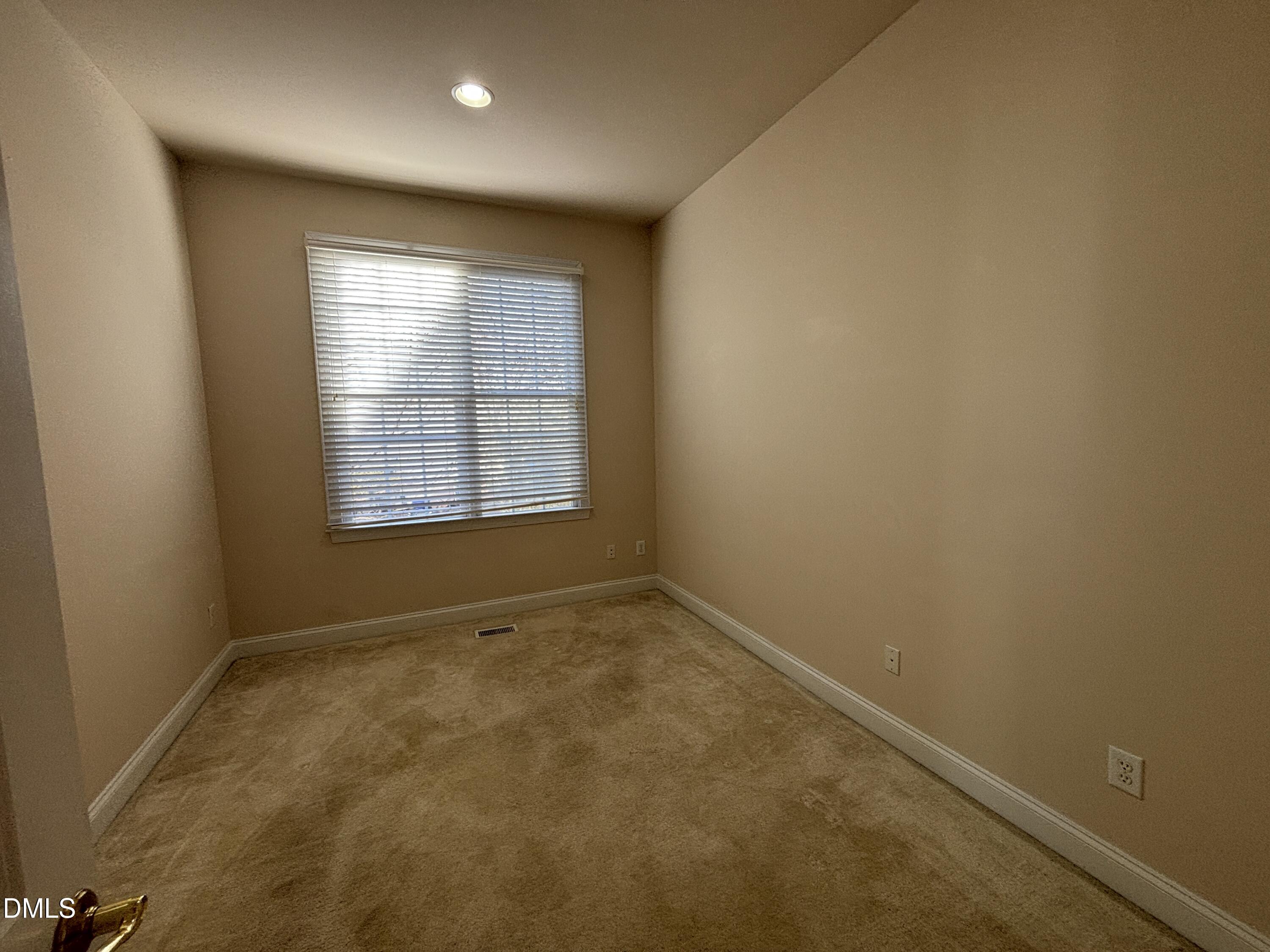 11729 Broadfield Court Raleigh, NC 27617 - Photo 11 of 47 an empty room with windows