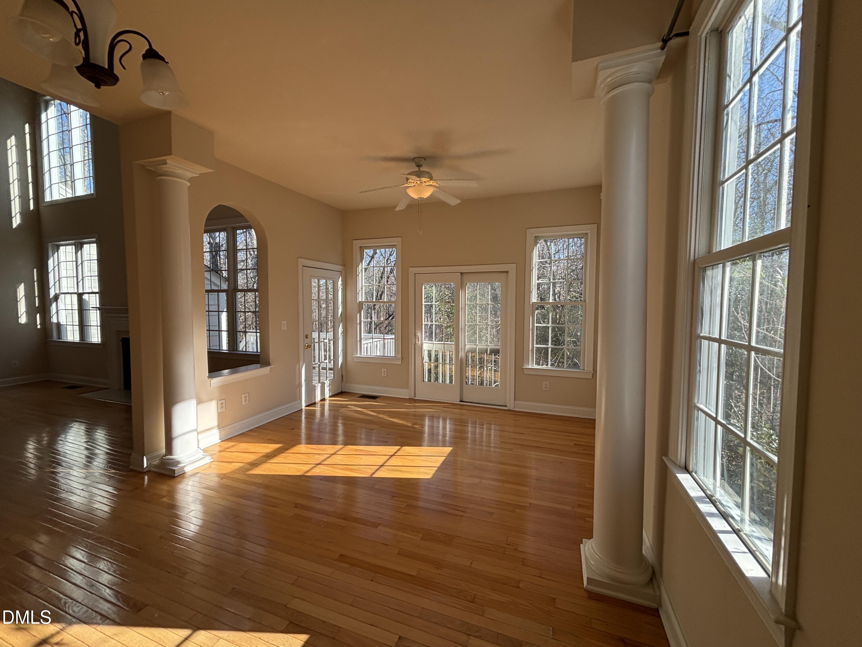 11729 Broadfield Court Raleigh, NC 27617 - Photo 16 of 47 a view of an entryway with wooden floor and a livingroom