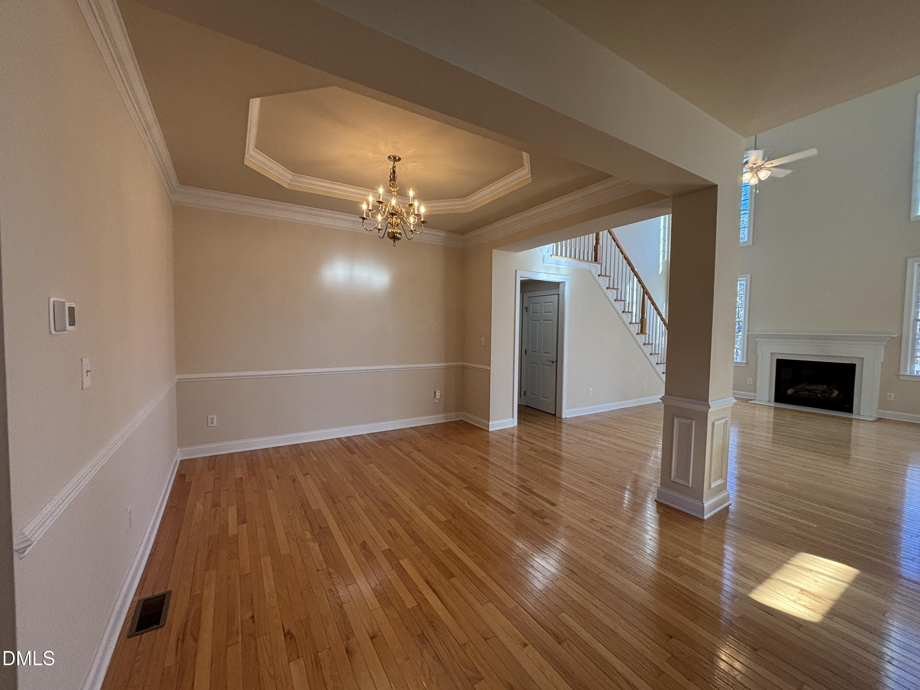 11729 Broadfield Court Raleigh, NC 27617 - Photo 2 of 47 wooden floor in an empty room with a window