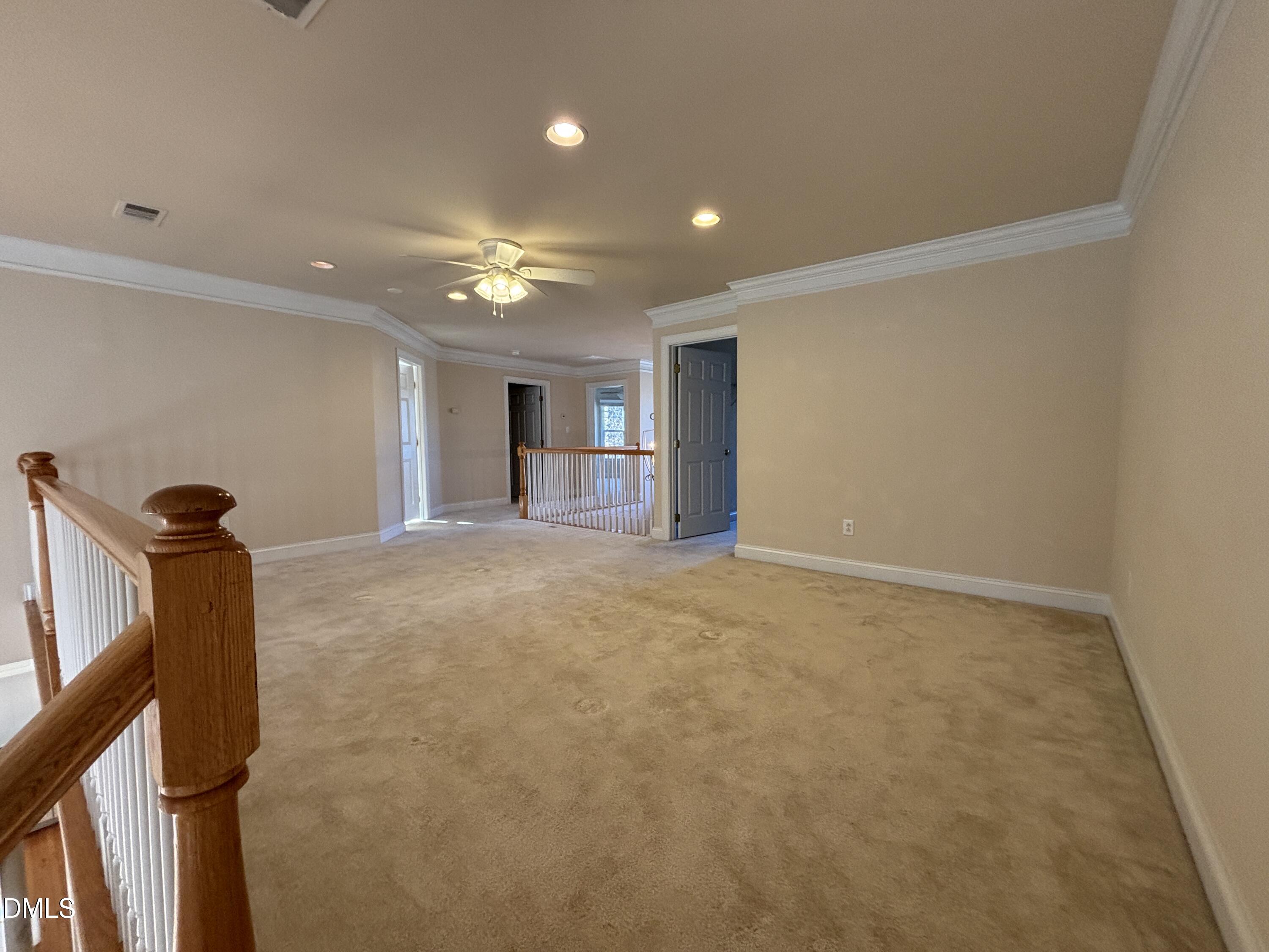 11729 Broadfield Court Raleigh, NC 27617 - Photo 26 of 47 a view of a livingroom with a staircase