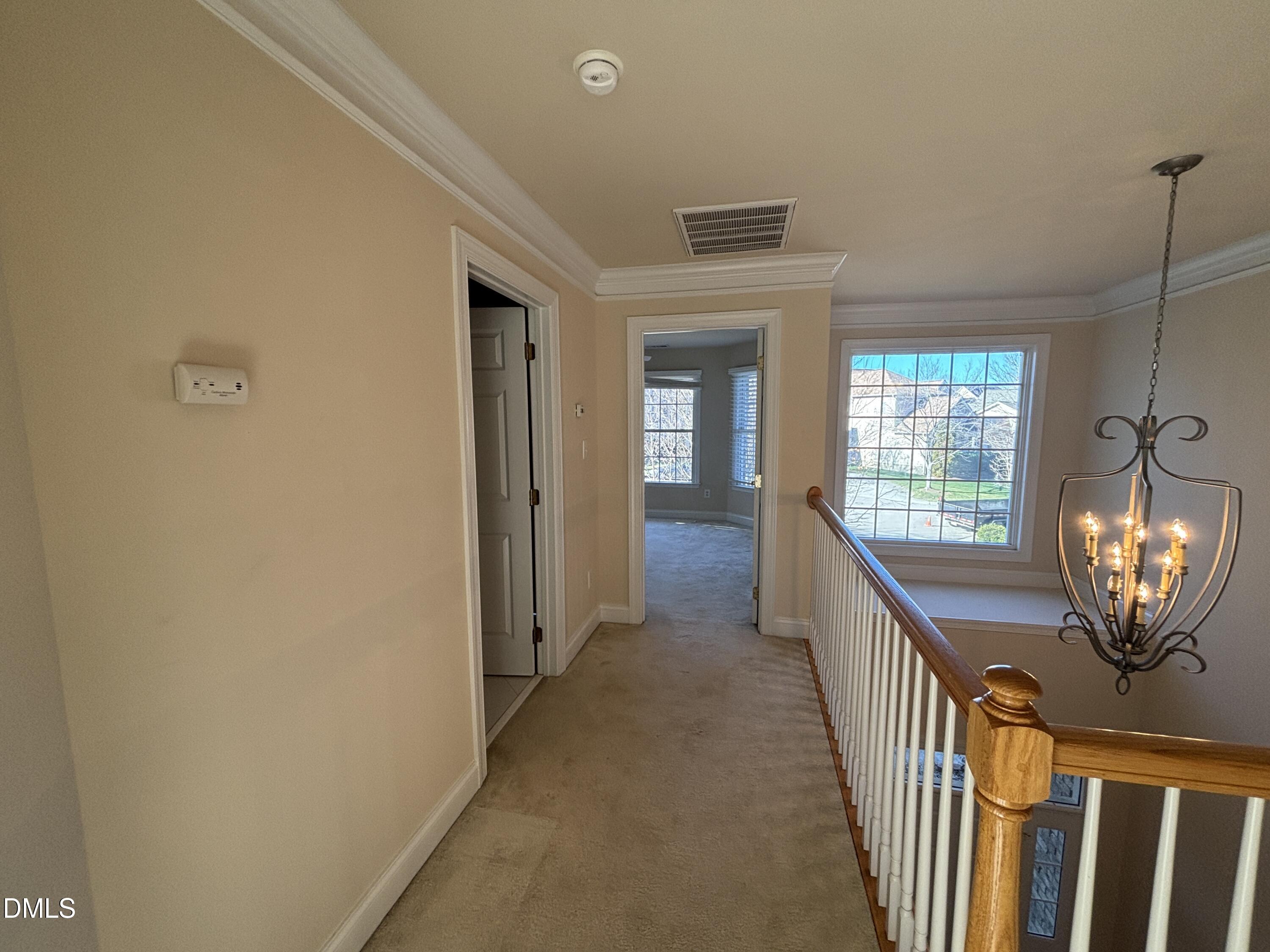 11729 Broadfield Court Raleigh, NC 27617 - Photo 32 of 47 a view of a hallway with windows