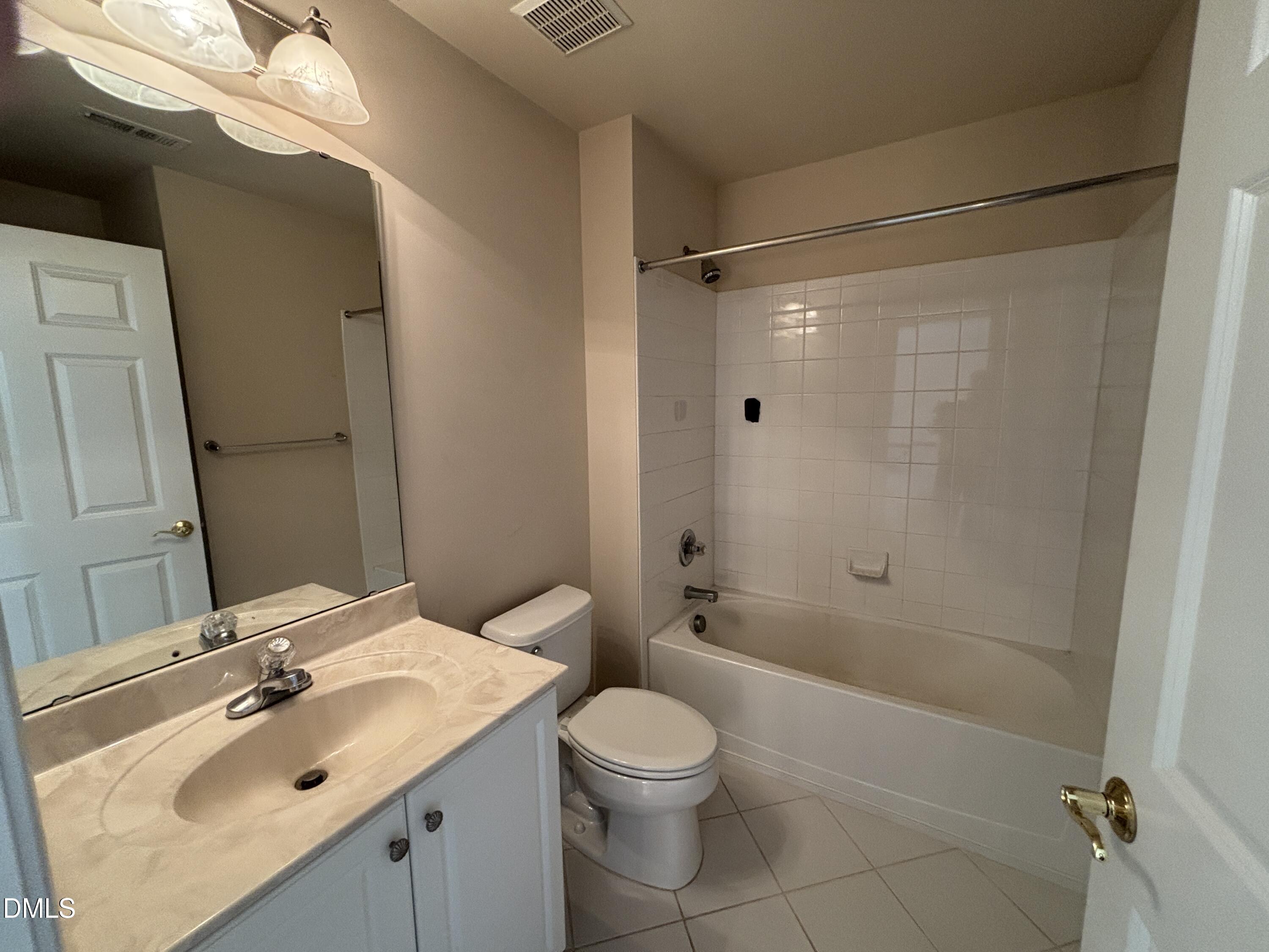 11729 Broadfield Court Raleigh, NC 27617 - Photo 33 of 47 a bathroom with a sink toilet and shower