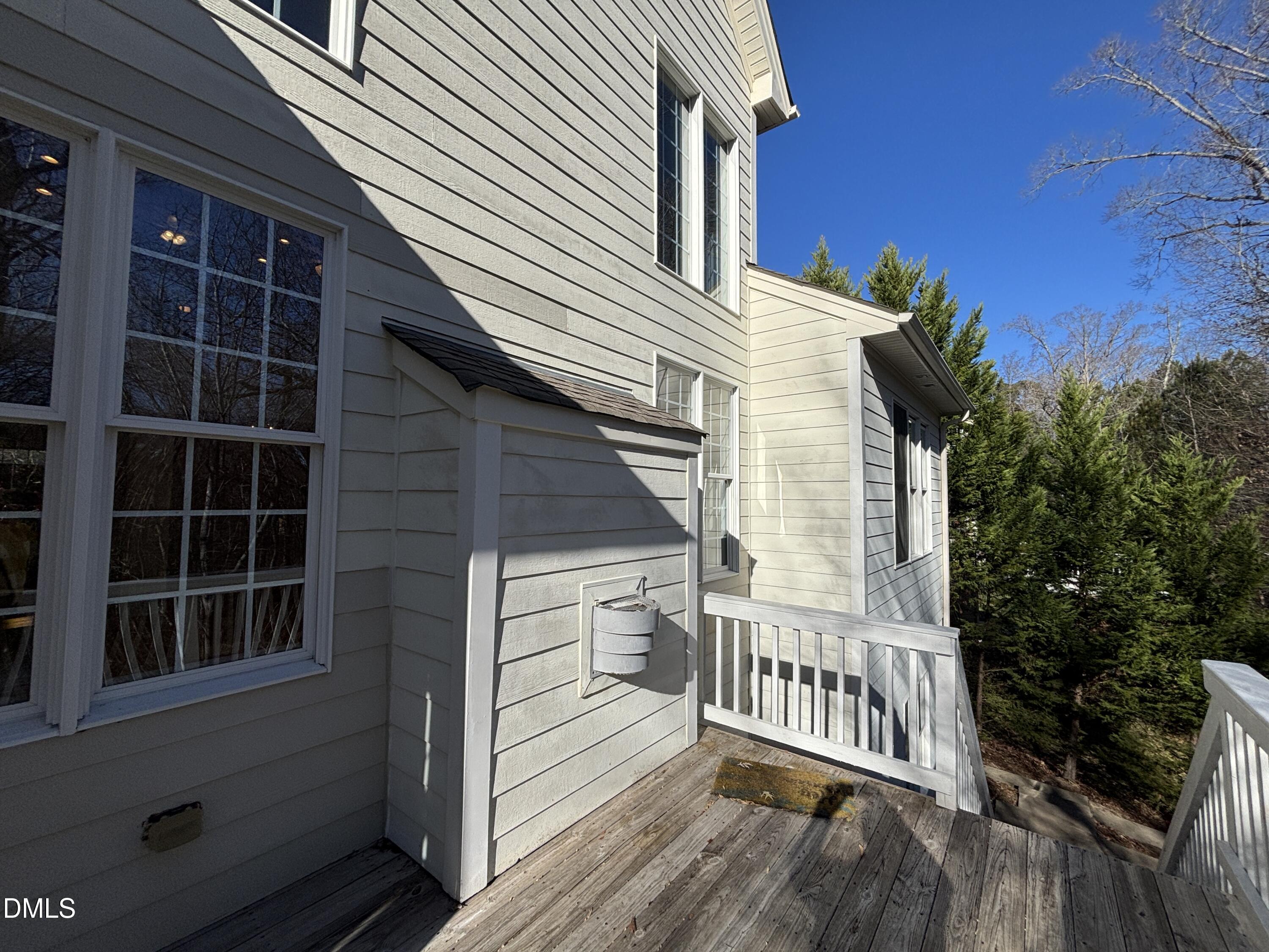 11729 Broadfield Court Raleigh, NC 27617 - Photo 44 of 47 a view of a house with a deck