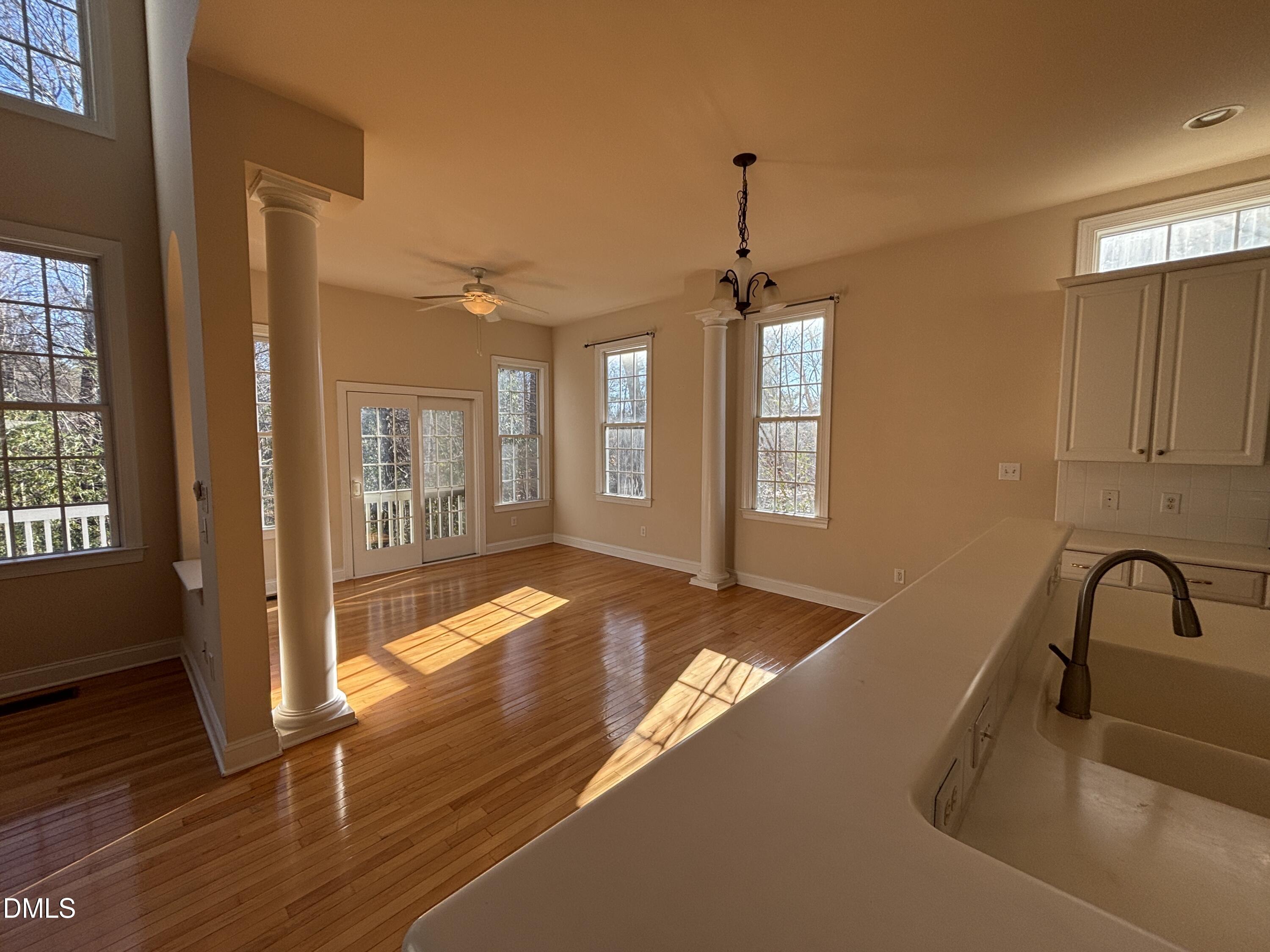 11729 Broadfield Court Raleigh, NC 27617 - Photo 5 of 47 a view of a sink and dishwasher with wooden floor