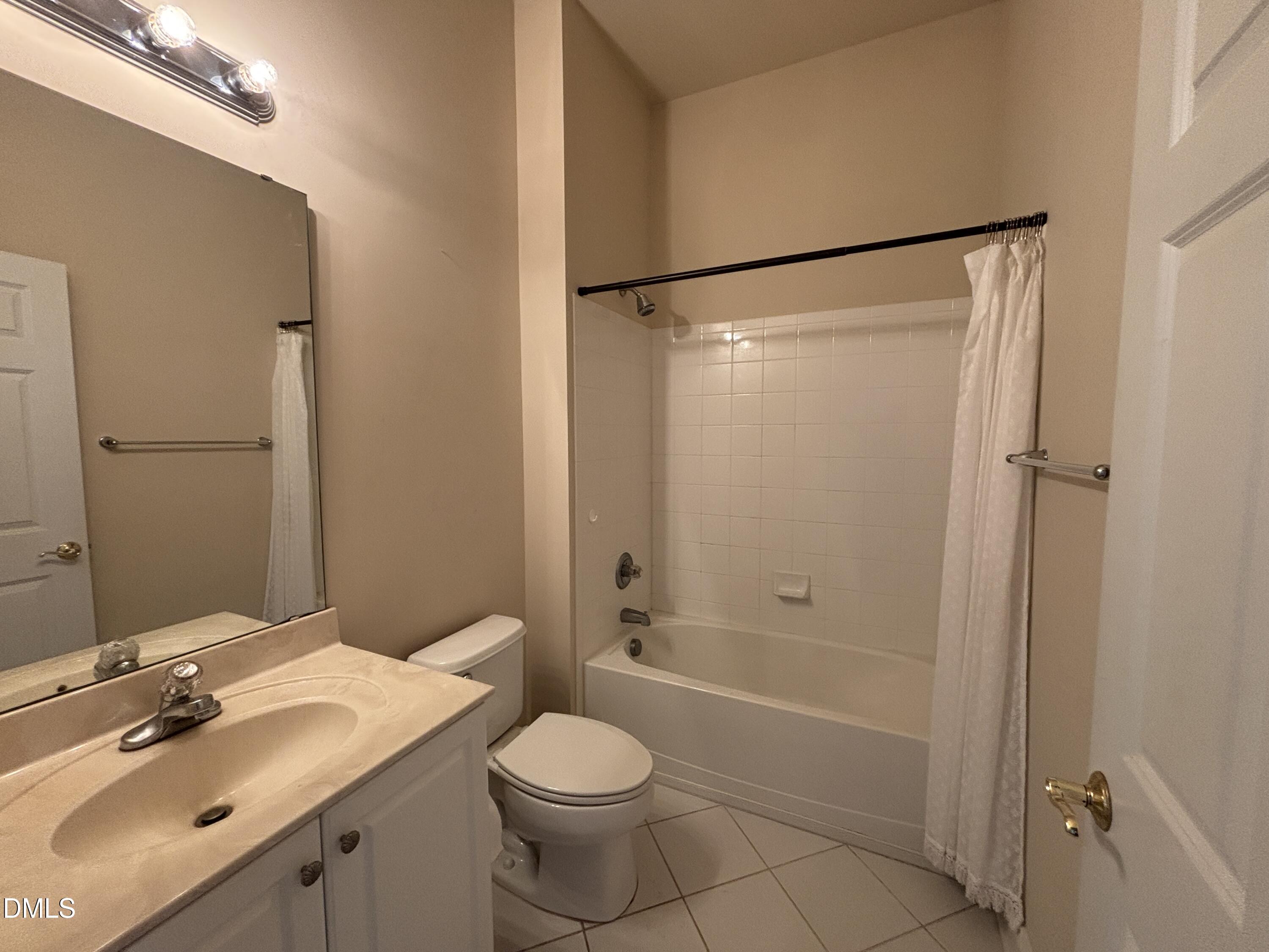 11729 Broadfield Court Raleigh, NC 27617 - Photo 10 of 47 a bathroom with a sink toilet and shower