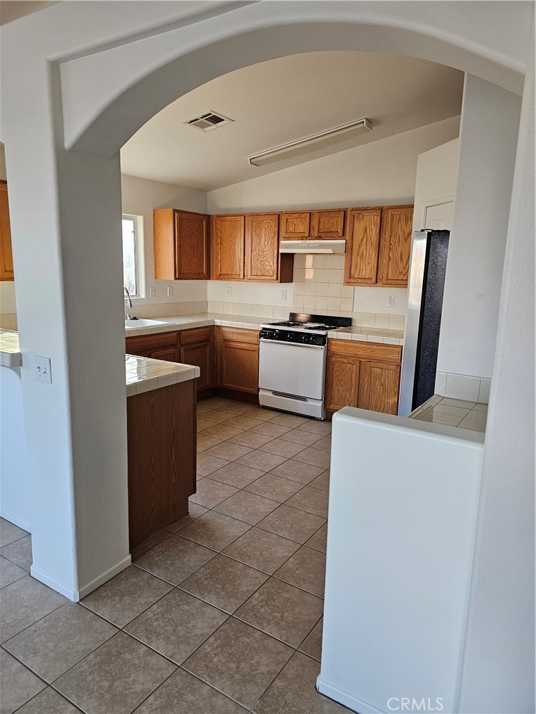 781 Aurora Way Blythe, CA 92225 - Photo 3 of 6 a living room with stainless steel appliances furniture a large window