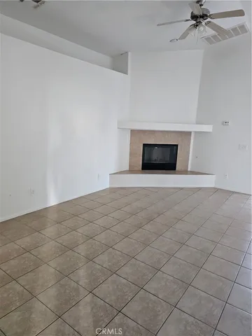 an empty room that has a window in it