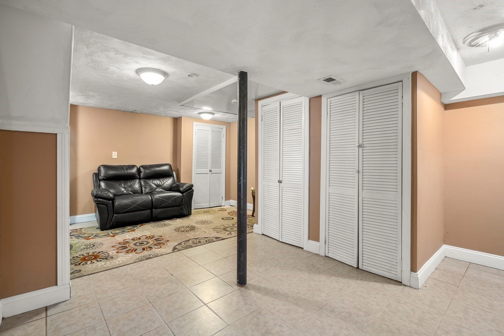 27 Upland Road Brockton, MA 02301 - Photo 18 of 25 a living room with furniture and a ceiling fan