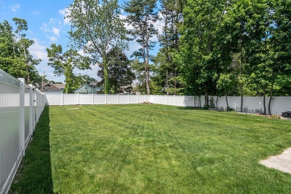 27 Upland Road Brockton, MA 02301 - Photo 25 of 25 a view of yard with green space and trees