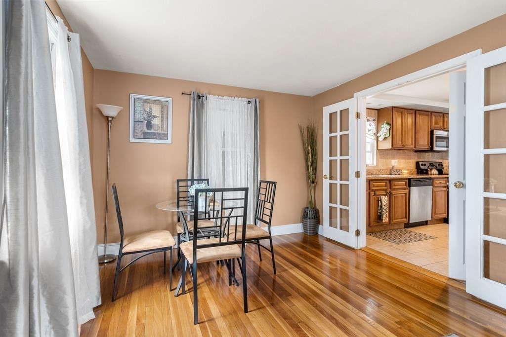 27 Upland Road Brockton, MA 02301 - Photo 4 of 25 a view of a dining room with furniture and wooden floor