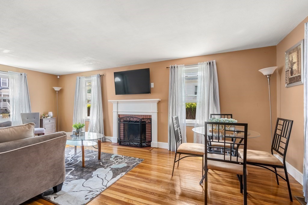 27 Upland Road Brockton, MA 02301 - Photo 5 of 25 a living room with furniture and a fireplace