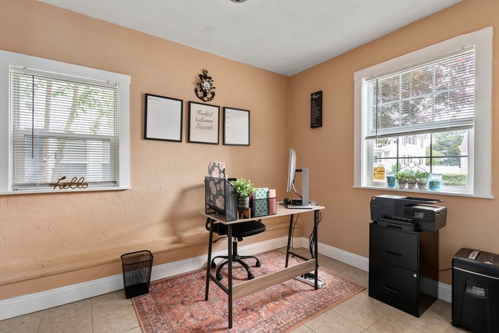 27 Upland Road Brockton, MA 02301 - Photo 9 of 25 a workspace with furniture and a window