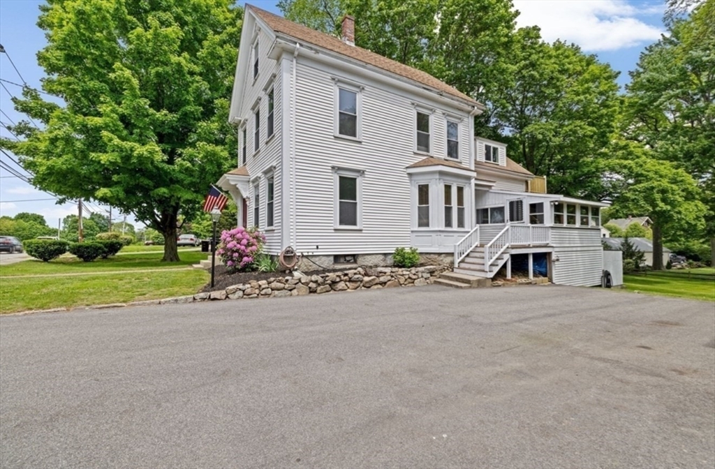 225 Pleasant Street, Unit 1 Weymouth, MA 02190 - Photo 10 of 10 a front view of house with yard and green space
