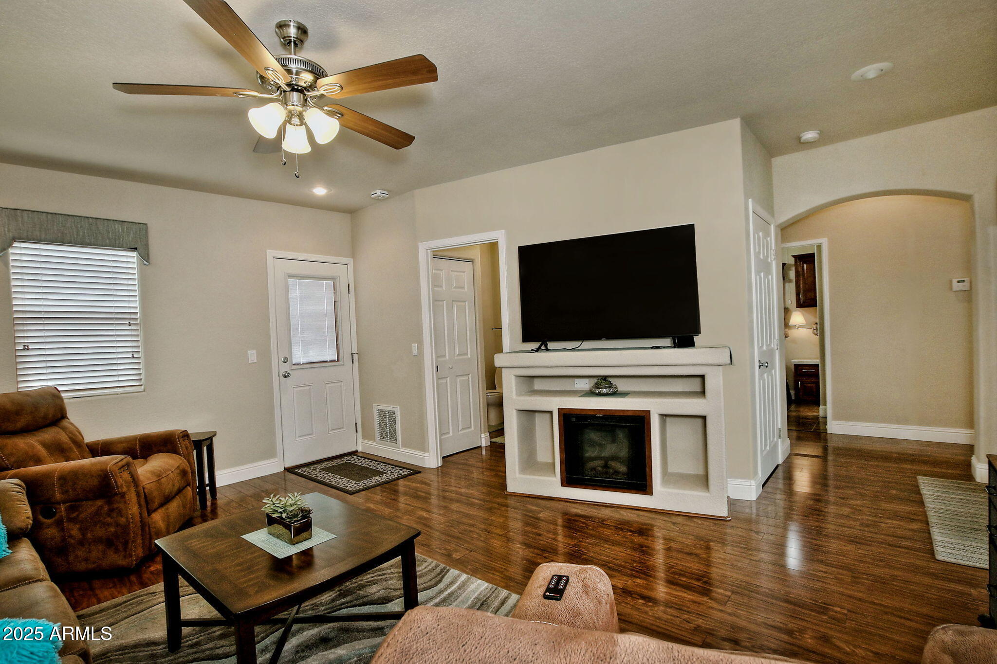 111 South Greenfield Road, Unit 462 Mesa, AZ 85206 - Photo 9 of 34 a living room with furniture and a flat screen tv