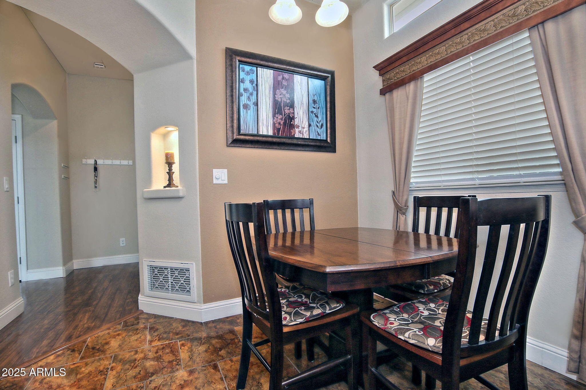 111 South Greenfield Road, Unit 462 Mesa, AZ 85206 - Photo 15 of 34 a dining room with furniture and wooden floor