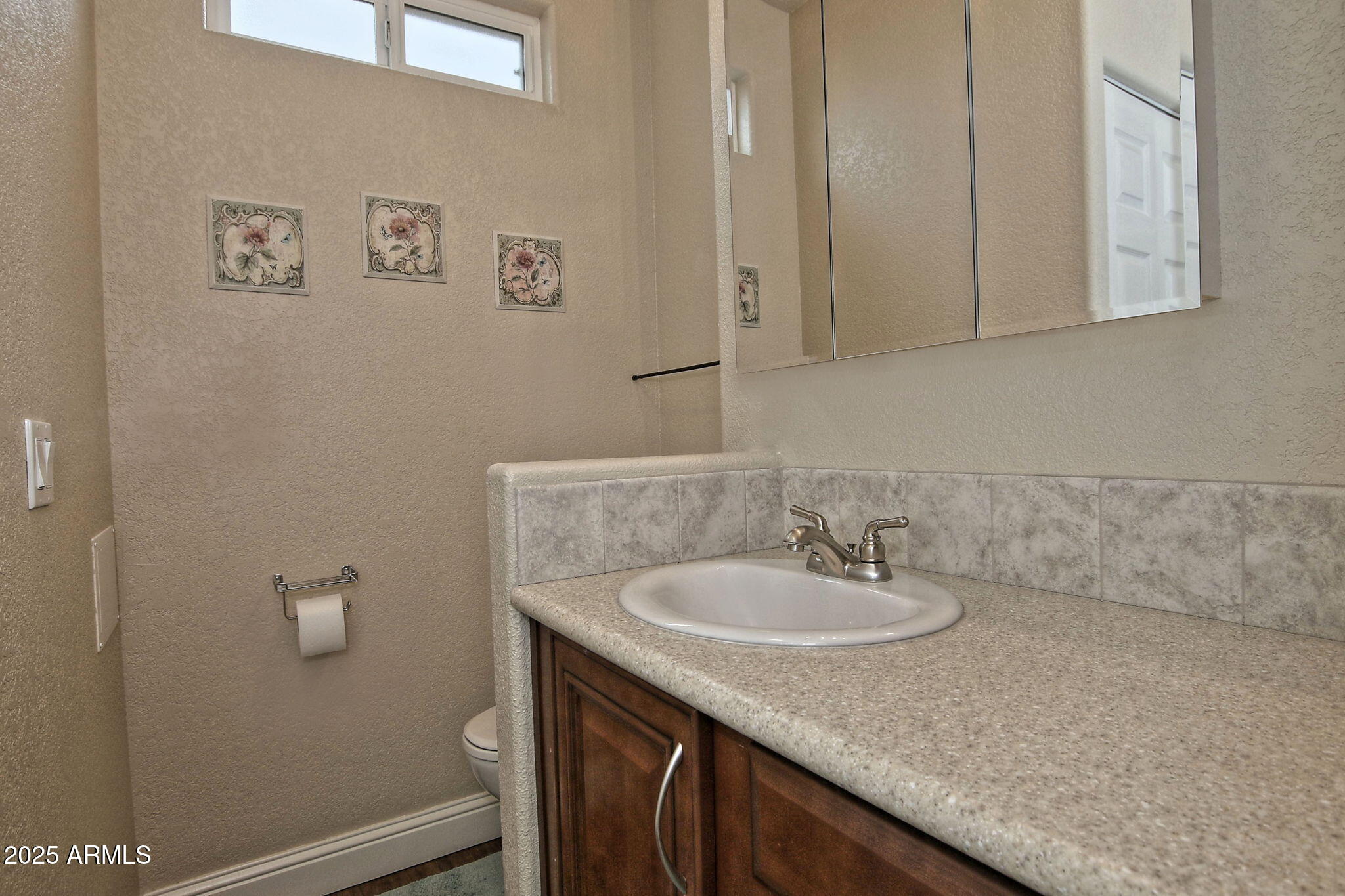 111 South Greenfield Road, Unit 462 Mesa, AZ 85206 - Photo 21 of 34 a bathroom with a granite countertop sink and a mirror