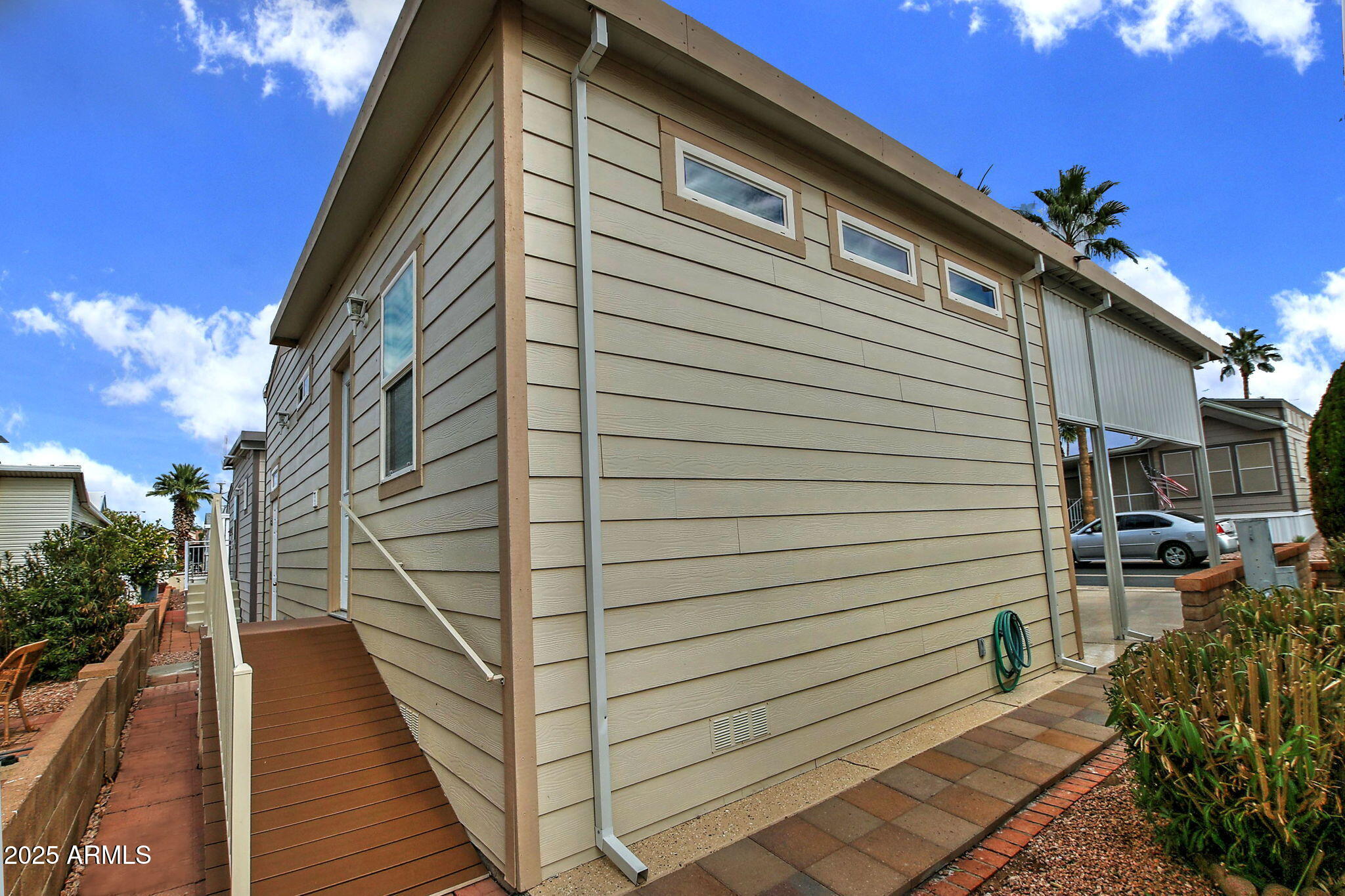 111 South Greenfield Road, Unit 462 Mesa, AZ 85206 - Photo 24 of 34 a view of a house with a patio
