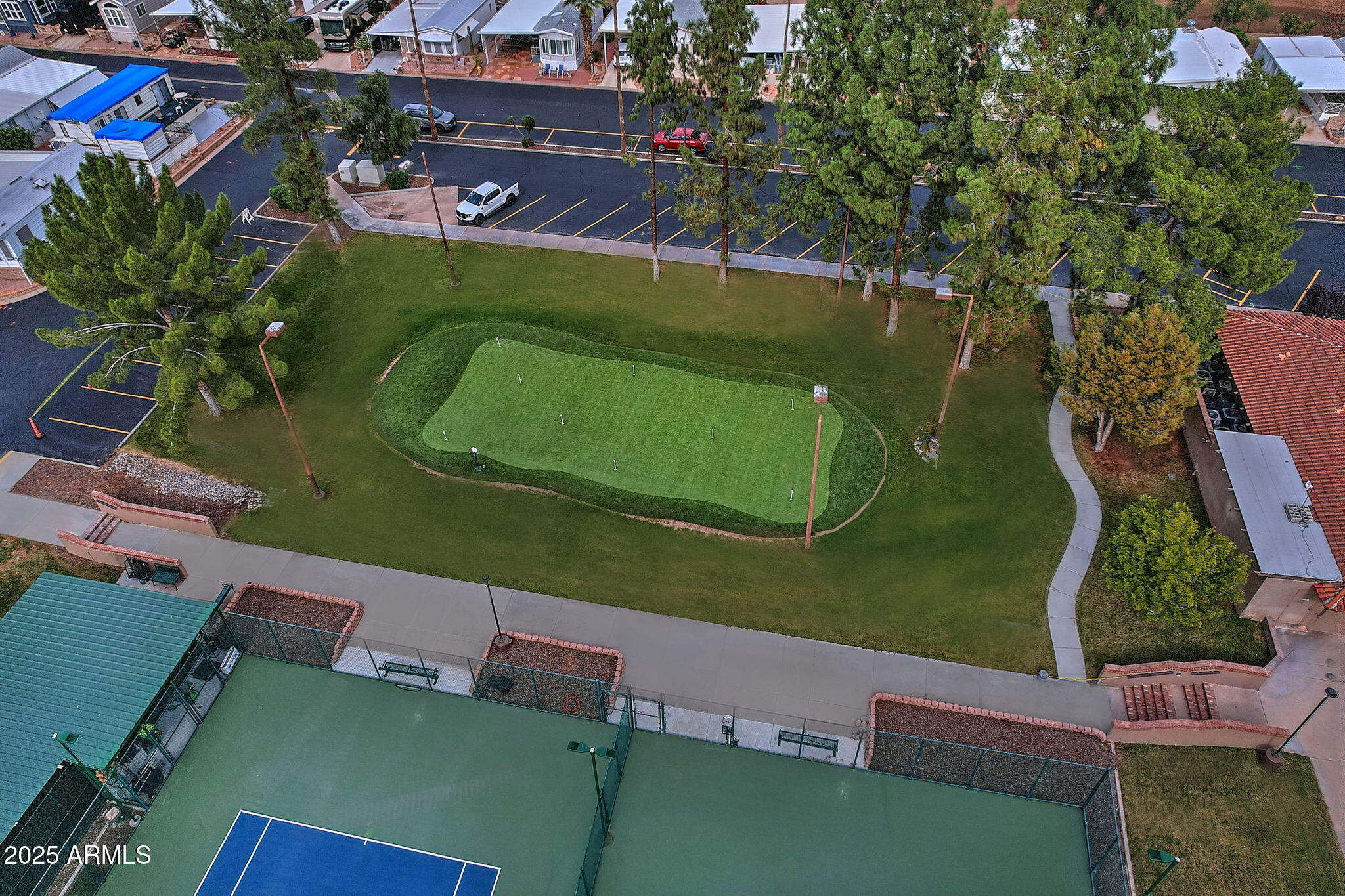 111 South Greenfield Road, Unit 462 Mesa, AZ 85206 - Photo 28 of 34 an aerial view of a house with a garden