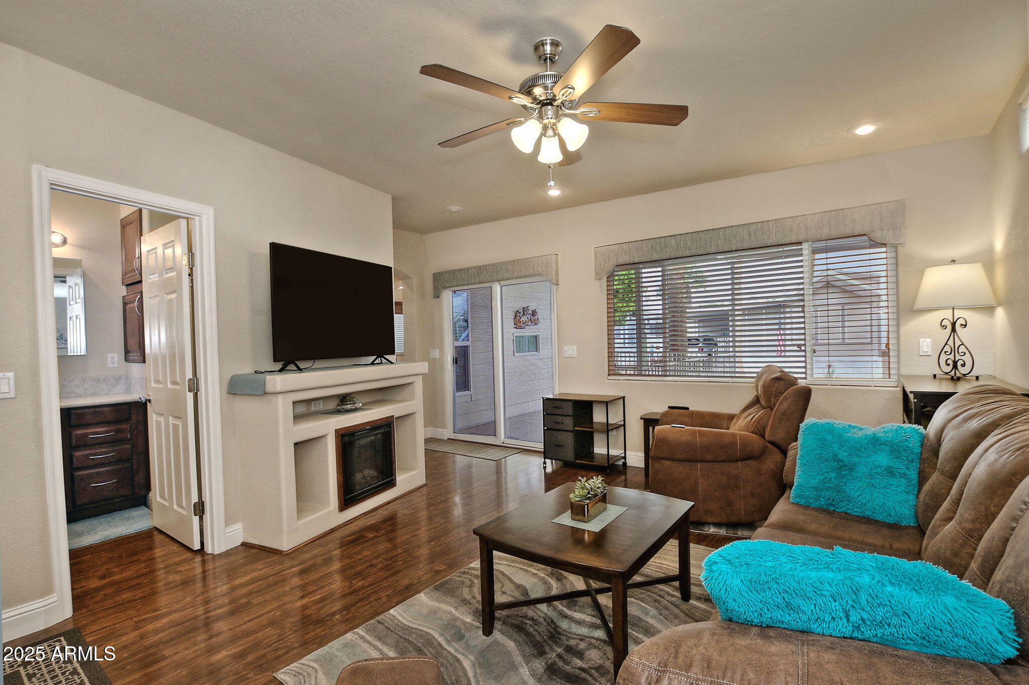 111 South Greenfield Road, Unit 462 Mesa, AZ 85206 - Photo 4 of 34 a living room with furniture fireplace and flat screen tv