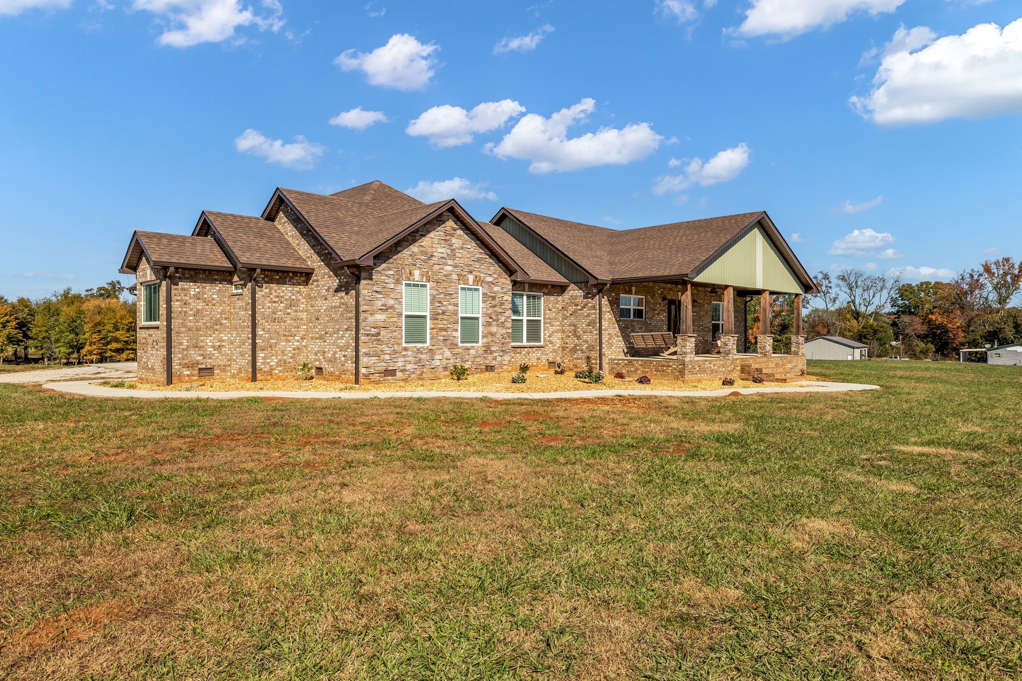1645 Oak Grove Road Decherd, TN 37324 - Photo 1 of 46 a front view of a house with a ocean view